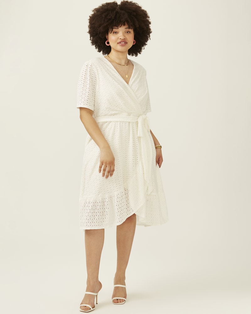 Plus size model with pear body shape wearing Paulina Embroidered Faux-Wrap Dress by Adorned | Dia&Co | dia_product_style_image_id:194023